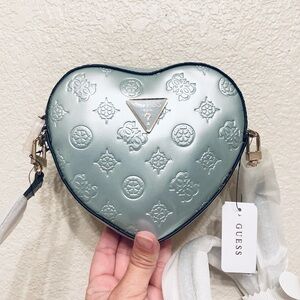 Gorgeous  Guess Arnela Debossed Logo Mini Heart icy blue zip up crossbody bag